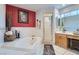 An inviting bathroom with a separate shower, tub, and plenty of natural light at 905 White Thunder St, Henderson, NV 89002