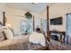 Main bedroom features a four poster bed, high ceilings, french doors, and lots of natural light at 905 White Thunder St, Henderson, NV 89002