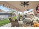 Spacious covered patio with ceiling fans, outdoor furniture, and a grill, great for gatherings at 905 White Thunder St, Henderson, NV 89002