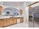Well-lit kitchen featuring white countertops, light wood cabinets and stainless fridge at 905 White Thunder St, Henderson, NV 89002