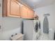 A practical laundry room with modern washer and dryer, ample storage, and functional layout at 905 White Thunder St, Henderson, NV 89002