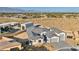 Wide aerial shot showing an expansive property with modern home design and surrounding landscape at 9570 Verde Way, Las Vegas, NV 89149
