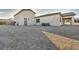 Wide shot of the home's backyard, with a covered patio and plenty of space for customization and outdoor enjoyment at 9570 Verde Way, Las Vegas, NV 89149