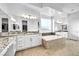 Bright bathroom with double vanity, granite countertop, large mirror and separate tub at 9570 Verde Way, Las Vegas, NV 89149