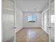 A bright room with tile floors, built in shelving and a large window at 9570 Verde Way, Las Vegas, NV 89149