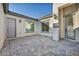 Private courtyard featuring beautiful pavers that lead to a modern front door at 9570 Verde Way, Las Vegas, NV 89149