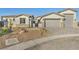 Charming home featuring a three-car garage and xeriscaping for low maintenance at 9570 Verde Way, Las Vegas, NV 89149