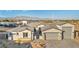 A front exterior featuring desert landscaping, a three car garage, and a gated courtyard at 9570 Verde Way, Las Vegas, NV 89149