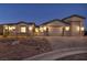 Well-maintained home showcasing desert landscaping, a gated courtyard, and a spacious three-car garage at 9570 Verde Way, Las Vegas, NV 89149