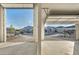 View from the garage of an open garage door to the street at 9570 Verde Way, Las Vegas, NV 89149