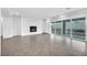 Bright open living space features a modern fireplace and large sliding glass doors at 9570 Verde Way, Las Vegas, NV 89149