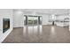 Bright open living space features a modern fireplace and large sliding glass doors at 9570 Verde Way, Las Vegas, NV 89149