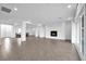 Spacious open living space with lots of natural light, tile floors and modern fireplace at 9570 Verde Way, Las Vegas, NV 89149