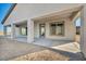 Covered patio featuring neutral colors, concrete flooring, and sliding glass door access to indoor living space at 9570 Verde Way, Las Vegas, NV 89149