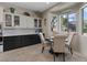 Cozy dining area with a window view and elegant furniture at 9668 Doraville Ave, Las Vegas, NV 89149