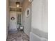 Inviting front entrance with a decorative wreath and stone floor at 9668 Doraville Ave, Las Vegas, NV 89149