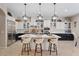 Modern kitchen featuring a large island, stainless steel appliances, and pendant lighting at 9668 Doraville Ave, Las Vegas, NV 89149