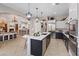 Modern kitchen with island, stainless steel appliances, and open floor plan at 9668 Doraville Ave, Las Vegas, NV 89149