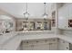 Open concept kitchen with bar seating, perfect for entertaining guests at 9668 Doraville Ave, Las Vegas, NV 89149