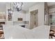 Modern kitchen bar with marble countertops and elegant lighting fixtures at 9668 Doraville Ave, Las Vegas, NV 89149