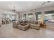 Spacious living room with plush seating and views to the outdoor pool at 9668 Doraville Ave, Las Vegas, NV 89149