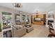 Spacious living room with fireplace, built-in cabinets and bright windows at 9668 Doraville Ave, Las Vegas, NV 89149
