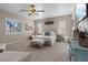 Relaxing main bedroom filled with natural light, plush carpeting, neutral walls, and stylish, comfortable furnishings at 9668 Doraville Ave, Las Vegas, NV 89149