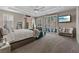 Spacious bedroom with tray ceilings, sitting area, and sliding glass doors at 9668 Doraville Ave, Las Vegas, NV 89149