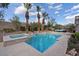 Beautiful in-ground pool and spa with meticulous landscaping, creating a serene outdoor retreat perfect for relaxation at 9668 Doraville Ave, Las Vegas, NV 89149