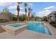 Beautiful in-ground pool and spa with meticulous landscaping, creating a serene outdoor retreat perfect for relaxation at 9668 Doraville Ave, Las Vegas, NV 89149