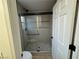 A modern bathroom features a glass-enclosed shower with neutral-toned tile and flooring at 9817 Kernville Dr, Las Vegas, NV 89134