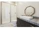 Modern bathroom with a glass shower, stylish vanity, and sleek mirror at 9938 Regency Canyon Way, Las Vegas, NV 89148