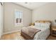 Bright bedroom with natural light, shuttered window, and modern decor at 9938 Regency Canyon Way, Las Vegas, NV 89148