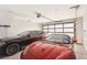Spacious garage with modern car collection and natural light at 9938 Regency Canyon Way, Las Vegas, NV 89148