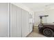 Organized garage with custom storage and epoxy flooring, adjacent to luxury sedan at 9938 Regency Canyon Way, Las Vegas, NV 89148