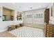 Cozy space with large windows, shutter blinds, built-in shelving, and unique tile flooring at 9938 Regency Canyon Way, Las Vegas, NV 89148