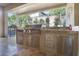 Outdoor kitchen featuring stainless steel grill, sink, and ample counter space for entertaining at 9938 Regency Canyon Way, Las Vegas, NV 89148