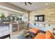 Inviting outdoor kitchen features a built-in grill, counter space, and comfortable seating at 9938 Regency Canyon Way, Las Vegas, NV 89148