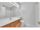 Bathroom features a vanity with modern fixtures and a white toilet at 10120 Cedar Key Ave # 201, Las Vegas, NV 89129