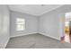 Neutral bedroom with carpet, a window, and views into the kitchen area at 10120 Cedar Key Ave # 201, Las Vegas, NV 89129