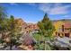 Exterior view of the community showcases tree-lined streets and well-maintained buildings at 10120 Cedar Key Ave # 201, Las Vegas, NV 89129