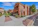 A sunny exterior view showcasing the building's architecture and landscaping at 10120 Cedar Key Ave # 201, Las Vegas, NV 89129