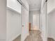 Hallway features modern closets and neutral walls and carpet throughout at 10120 Cedar Key Ave # 201, Las Vegas, NV 89129