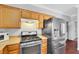 Galley-style kitchen featuring stainless steel appliances, range, microwave, and wood cabinets at 10120 Cedar Key Ave # 201, Las Vegas, NV 89129