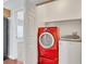 Laundry room with washer, dryer, and storage shelf, conveniently located near other rooms at 10120 Cedar Key Ave # 201, Las Vegas, NV 89129