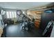 Bright home gym with modern equipment, wood accent wall, and natural light at 10323 Hardy Falls St, Las Vegas, NV 89141
