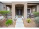 Inviting front porch with desert landscaping and covered entrance at 10323 Hardy Falls St, Las Vegas, NV 89141
