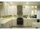 Modern kitchen with stainless steel appliances, and lots of cabinet space at 10323 Hardy Falls St, Las Vegas, NV 89141