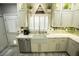 Bright kitchen with stainless steel dishwasher, and modern cabinetry at 10323 Hardy Falls St, Las Vegas, NV 89141