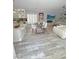 Living area showcases an open floorplan with an updated kitchen, dining space, modern fireplace and decor at 10323 Hardy Falls St, Las Vegas, NV 89141
